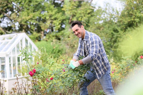 Local hedge maintenance work in Hackney Marshes on a residential garden hedge
